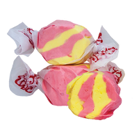Taffy Town’s Strawberry Banana taffy candy with bright pink and yellow swirls—whipped salt water taffy with a smooth, fruity flavor combo.