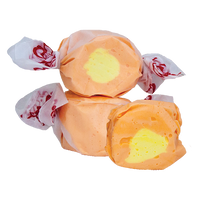 Mango Taffy by Taffy Town – tropical orange color salt water taffy candy with a creamy yellow center, bursting with juicy mango flavor in every bite.